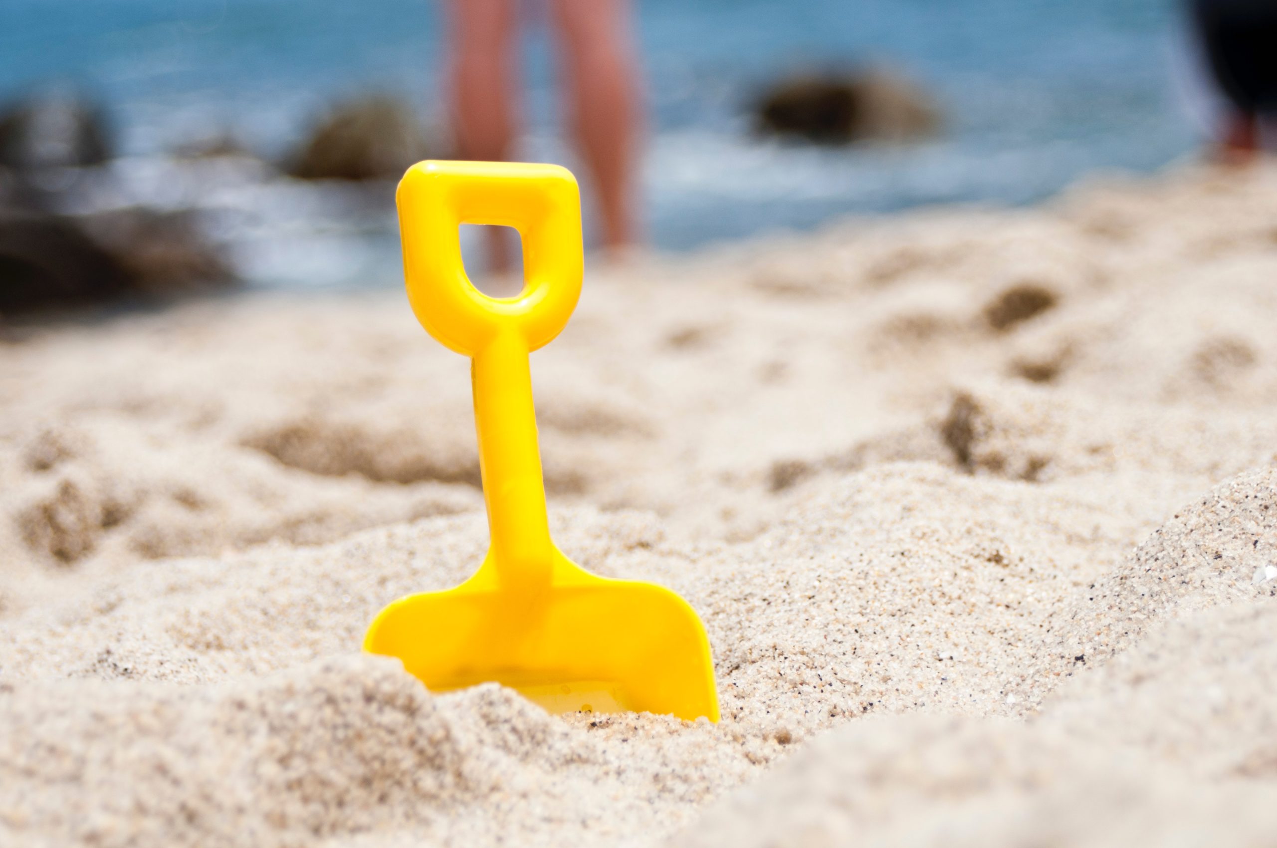 toy trowel on beach